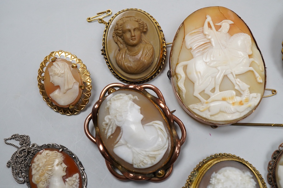 A collection of shell cameo brooches, comprising: a cameo depicting Bacchus, in a gold mount in the Archaeological Revival style, decorated with rope twist and a twisted knife wire border, length 4.4cm; together with sev
